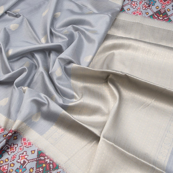 Raw Silk Grey Saree With Zari Buttas On The Body
