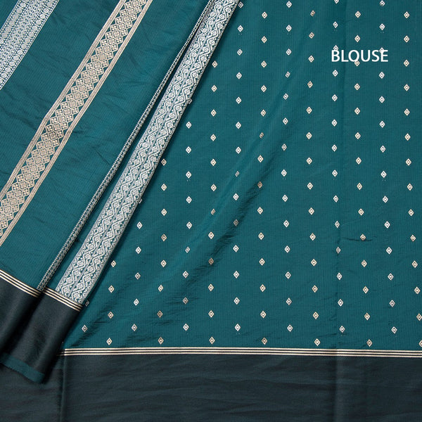 Raw Silk Teal Green Saree With Zari Stripes Design And Simple Border