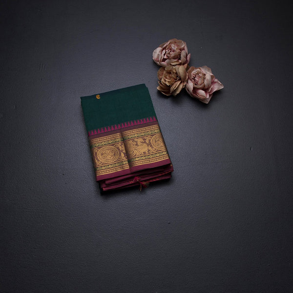 Kanchi Cotton Dark Green Saree With Thread Buttas And Temple Border