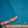 Kanchi Cotton Peacock Blue Saree With Zari Buttas And Rettapet Border