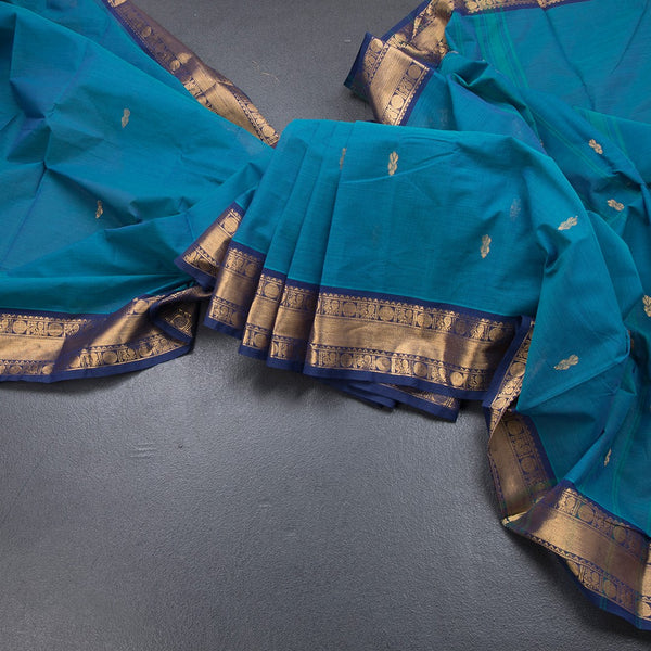 Kanchi Cotton Peacock Blue Saree With Zari Buttas And Rettapet Border
