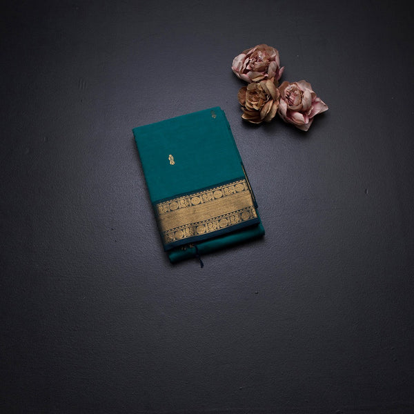 Kanchi Cotton Peacock Green Saree With Zari Buttas And Zari Border