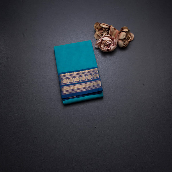 Kanchi Cotton Peacock Blue Plain Saree And Zari Border