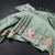 Raw Silk Pista Green Zari Checked Saree And Floral Thread Border