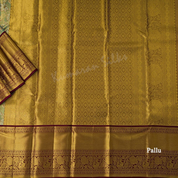 Green Tissue Silk Saree With Floral Design And Gold Zari Border