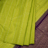Green silk saree with vertical gold and silver zari design and contrast pallu