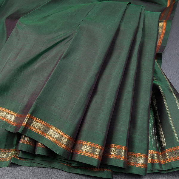 Bottle Green Plain Silk Saree And Thread With Zari Border