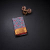 Greyish Blue Silk Saree With Floral Weaves And Pink Zari Border