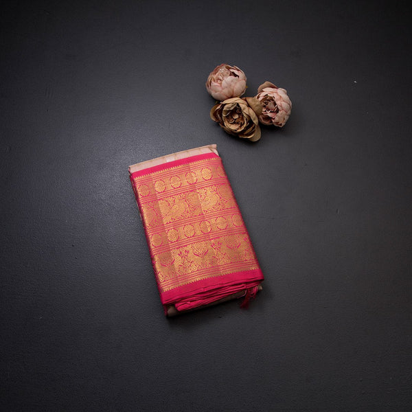 Pink Silk Saree With Peacock And Chakra Buttas On The Body With Yazhi Designed Red Border