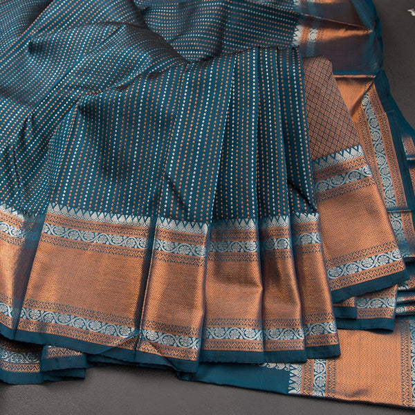 Dark Green Silk Saree With Tiny Copper And Silver Zari Buttis And Zari Border