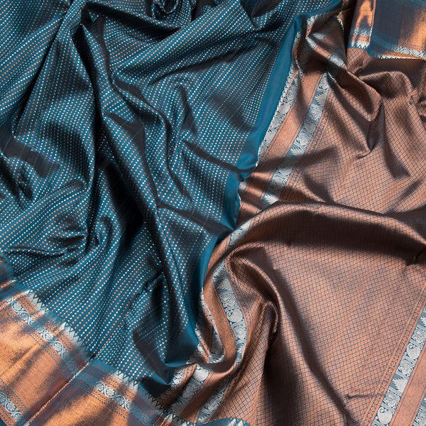 Dark Green Silk Saree With Tiny Copper And Silver Zari Buttis And Zari Border