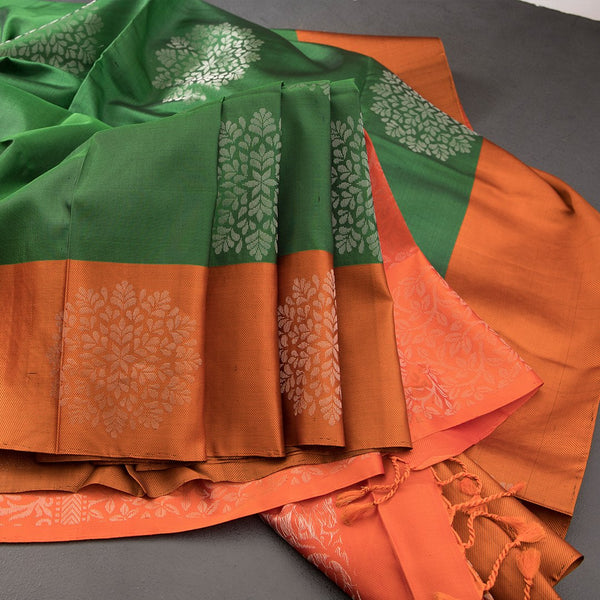 Emerald Green Soft Silk Saree With Orange Border And Floral Zari Motifs Over The Body