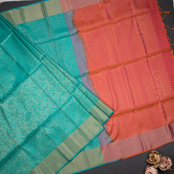 Turquiose Blue Brocade Soft Silk Saree With Orange Coloured Floral Designed Pallu