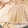 Beige Silk Saree With Stylish Yellow Patterns Adorning The Body And Grey Zari Border