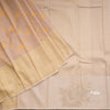 Beige Silk Saree With Stylish Yellow Patterns Adorning The Body And Grey Zari Border