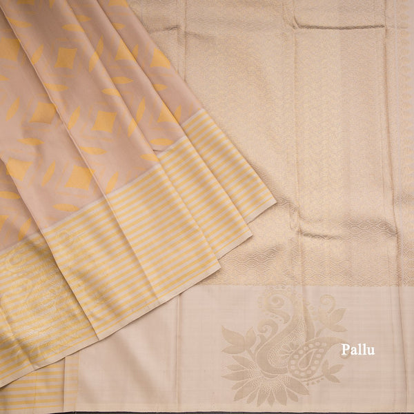 Beige Silk Saree With Stylish Yellow Patterns Adorning The Body And Grey Zari Border