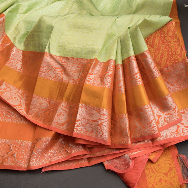 Light Green Self Designed Silk Saree With Orange Border And Gold And Silver Zari Work