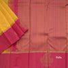Lemon Yellow Embossed Kanchipuram Silk Saree With Contrast Pink Border