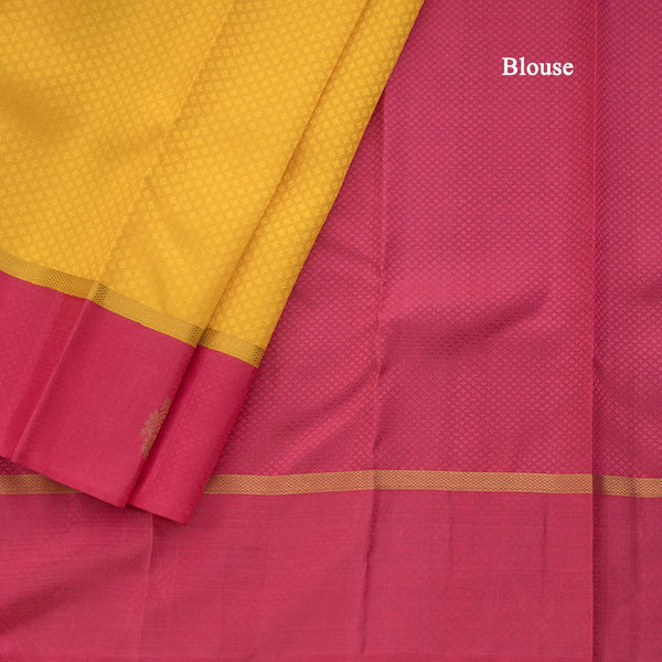 Lemon Yellow Embossed Kanchipuram Silk Saree With Contrast Pink Border