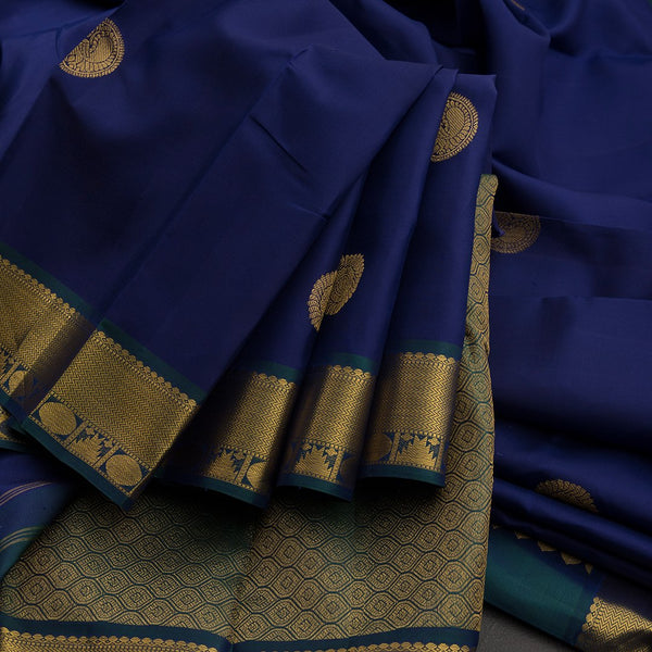 Traditional Navy Blue Kanchipuram Silk Saree With Peacock And Chakram Motifs
