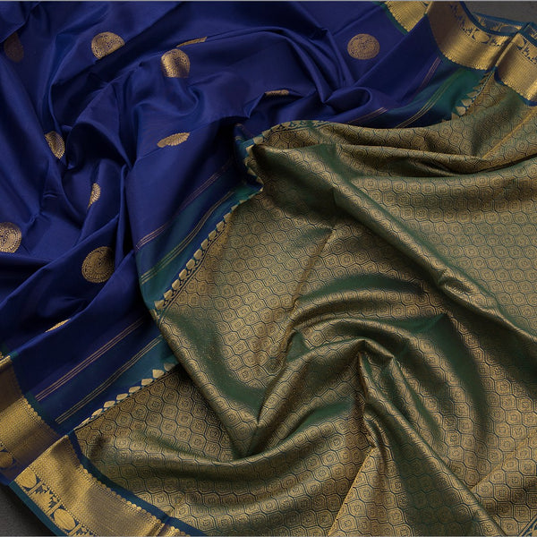 Traditional Navy Blue Kanchipuram Silk Saree With Peacock And Chakram Motifs