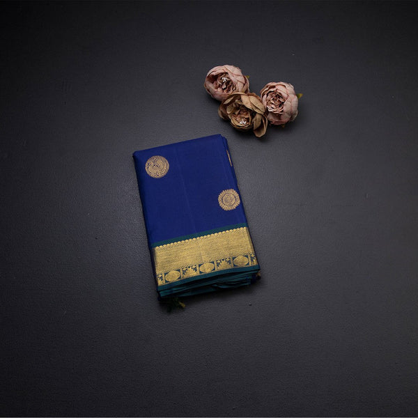 Traditional Navy Blue Kanchipuram Silk Saree With Peacock And Chakram Motifs