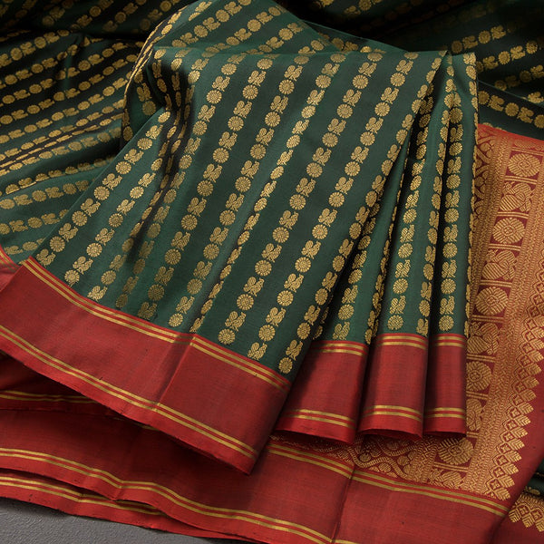 Bottle Green Kanchipuram Silk Saree With Vertically Running Chakra And Peacock Designs