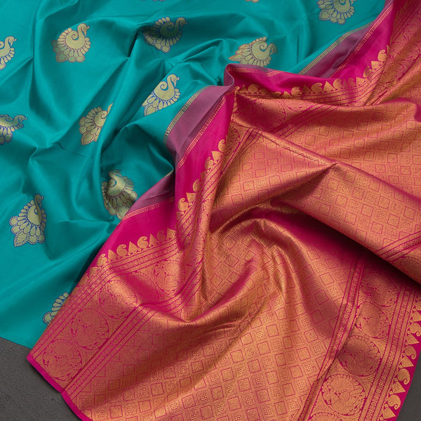 Borderless Turquoise Blue With Peacock Butta On Body With Contrast Pallu