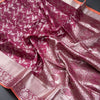Wine Shaded Soft Silk Saree With Floral Pattern On The Body