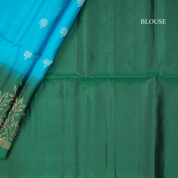 Rama Blue Soft Silk Saree With Tiny Buttis On Body And Green Leaves Patterned Border