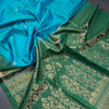 Rama Blue Soft Silk Saree With Tiny Buttis On Body And Green Leaves Patterned Border