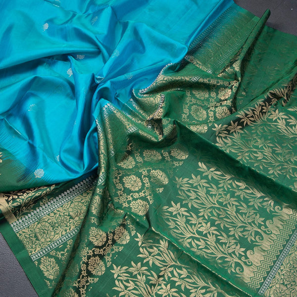 Rama Blue Soft Silk Saree With Tiny Buttis On Body And Green Leaves Patterned Border