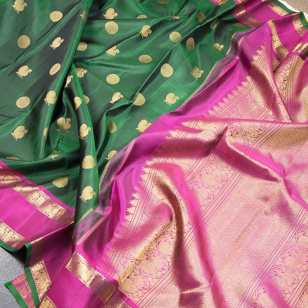Bottle Green Silk Saree With Peacock And Chakra Buttas And Rettapet Border