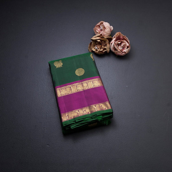 Bottle Green Silk Saree With Peacock And Chakra Buttas And Rettapet Border