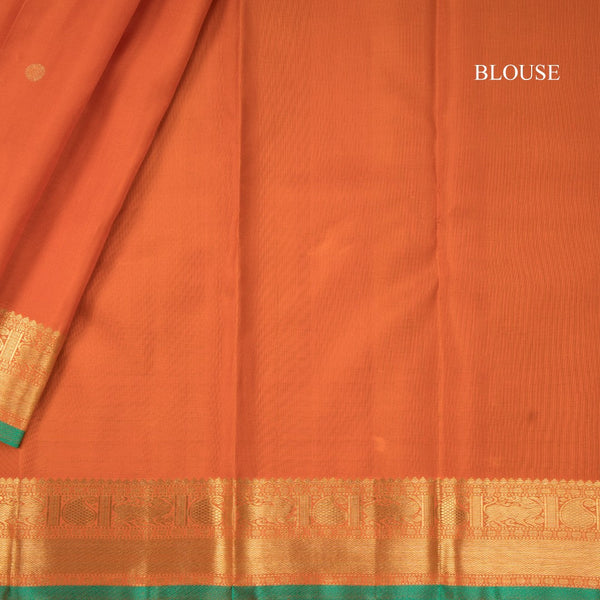 Rust Orange Silk Saree With Peacock And Chakra Buttas And Gold Zari Border