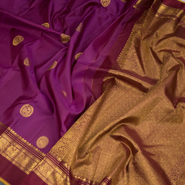 Magenta Silk Saree With Animal Motif On The Body And Zari With Thread Embossed Border