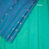 Shot Colour Borderless Silk Saree With Floral Zari Buttas On The Body