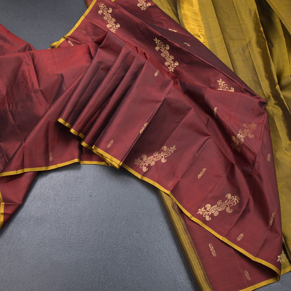 Maroon Borderless Silk Saree With Floral Zari Buttas On The Body