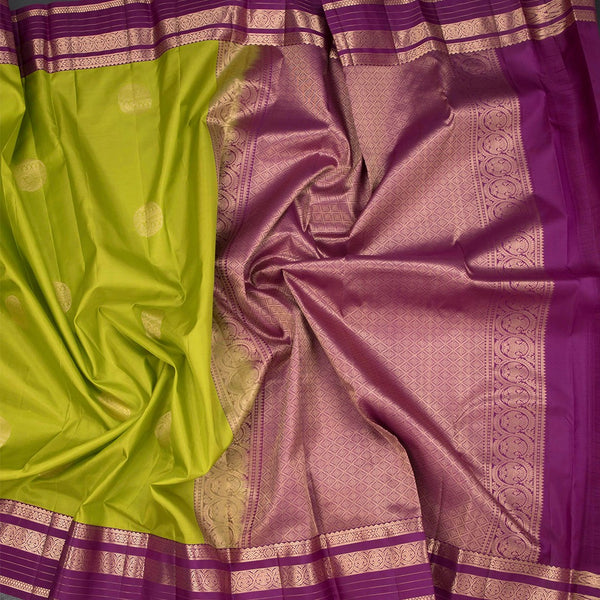 Lime Green Silk Saree With Chakra Buttas On The Body And Purple Zari Border