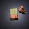 Pista Green Soft Silk Saree With Peacock Buttas On The Body And Orange Zari Border