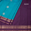 Peacock Blue Silk Saree With Chakra Buttas On The Body And Purple Zari Border