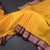 Mango Yellow Soft Silk Saree With Peacock Buttas On The Body And Purple Zari Border