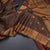 Vairaoosi Dark Brown Silk Saree With Peacock And Chakra Buttas And Gold Zari Border