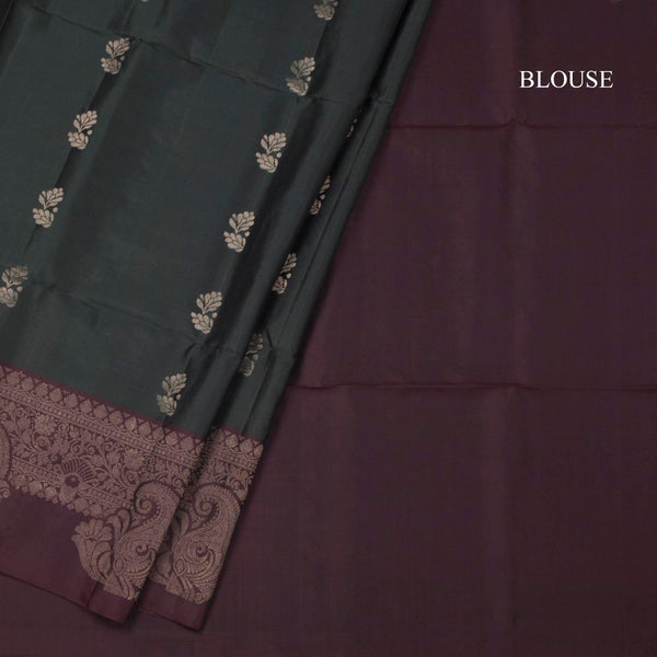 Bottle Green Soft Silk Saree With Floral Buttas And Brown Border