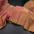 Peach Silk Saree With Small Buttas And Gold Zari Border