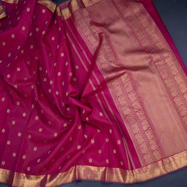 Reddish Pink Silk Saree With Peacock And Chakra Buttas And Gold Zari Border