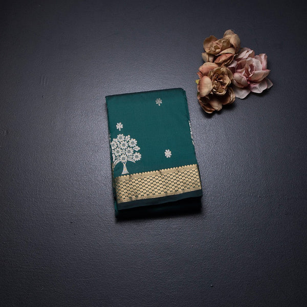 Semi Silk Dark Green Saree With Floral And Tree Design And Zari Border