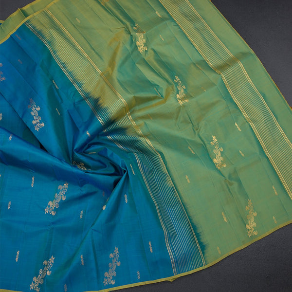 Peacock Blue Borderless Silk Saree With Zari Buttas