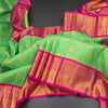 KSSMLSR42082-Parrot-Green-Checked-Silk-Saree-With-Peacock-And-Chakra-Buttas-And-Zari-Border-main