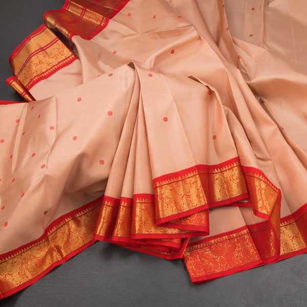 KSSMLSR42356-Light-Peach-Silk-Saree-With-Thread-Buttas-And-Temple-Zari-Border-main